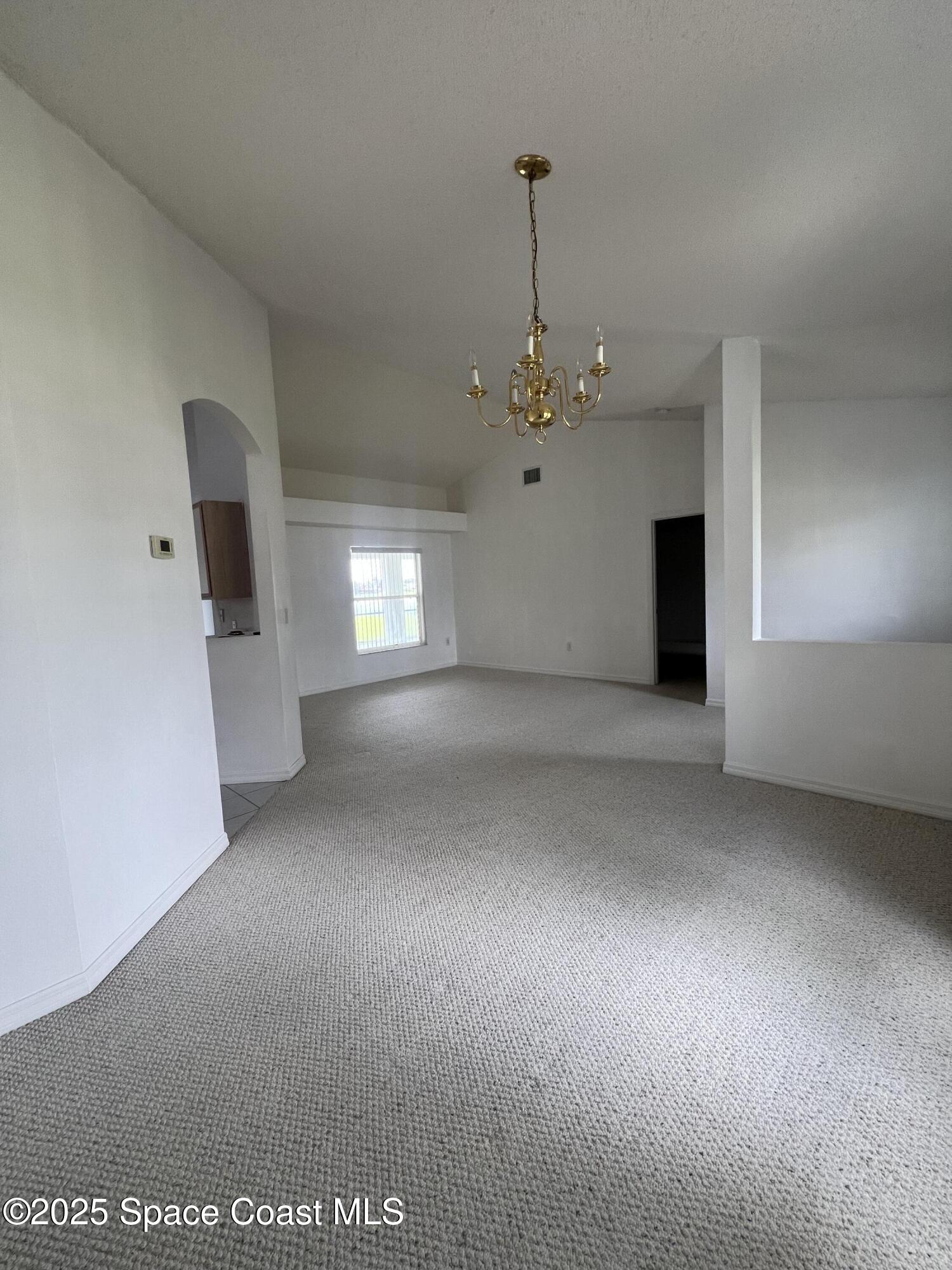 1213 Old Millpond Road Melbourne, FL 32940 - Photo 4 of 20 a view of empty room with window