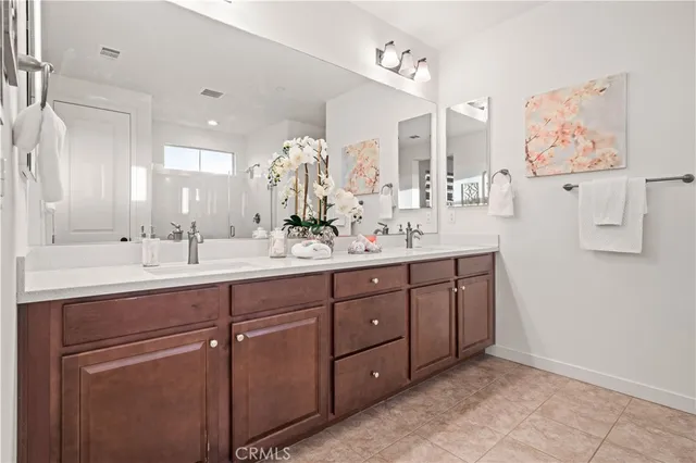 a bathroom with a double vanity sink mirror and double