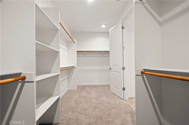 a view of an empty walk in closet