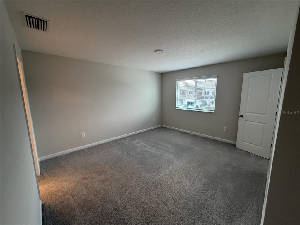 4632 Campsite Loop Orlando, FL 32824 - Photo 11 of 22 a view of an empty room with a window