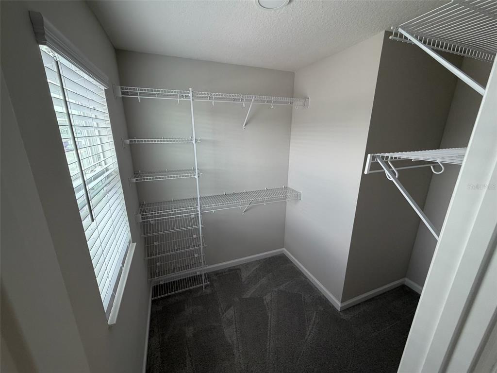 4632 Campsite Loop Orlando, FL 32824 - Photo 14 of 22 a bathroom with a shower and a sink