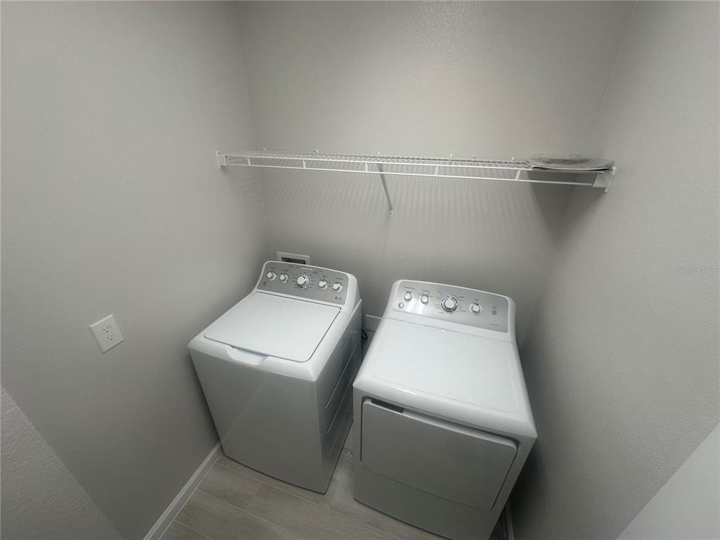 4632 Campsite Loop Orlando, FL 32824 - Photo 15 of 22 a utility room with dryer and washer