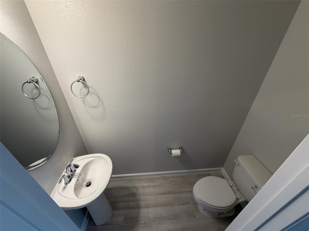 4632 Campsite Loop Orlando, FL 32824 - Photo 5 of 22 a bathroom with a toilet and a sink