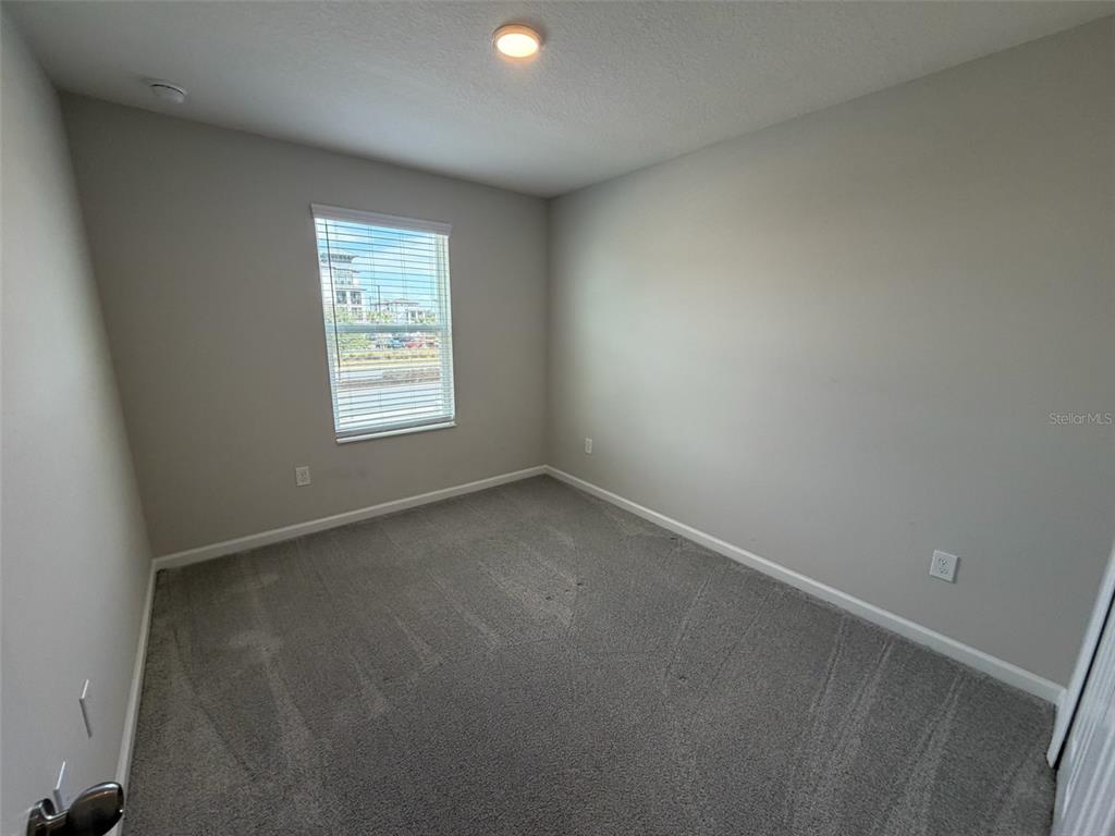 4632 Campsite Loop Orlando, FL 32824 - Photo 10 of 22 an empty room with a window