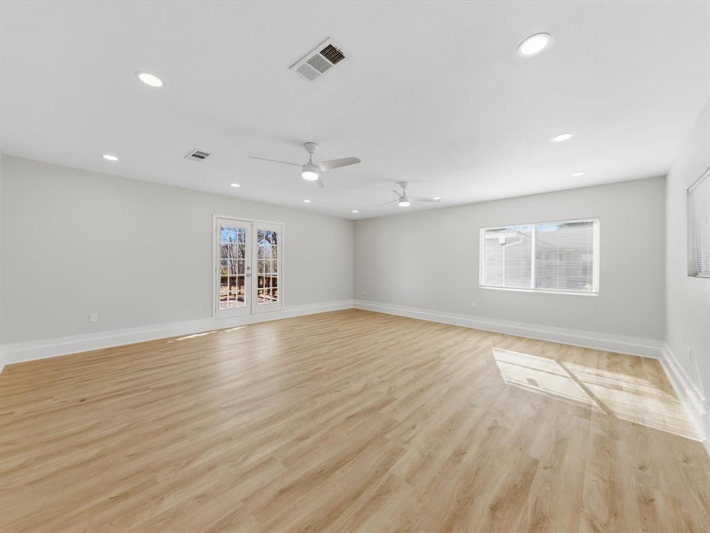 4013 Oleander Trail Mesquite, TX 75150 - Photo 11 of 28 Unfurnished room featuring light wood-style flooring, plenty of natural light, and recessed lighting