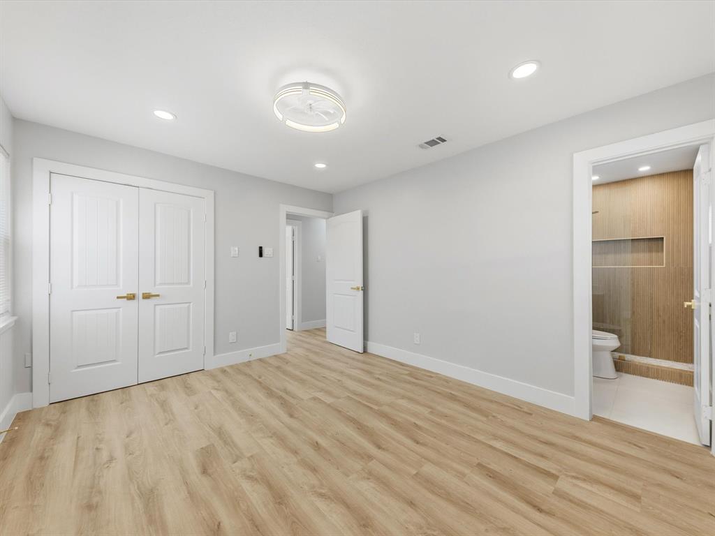 4013 Oleander Trail Mesquite, TX 75150 - Photo 13 of 28 Unfurnished bedroom with light wood-style flooring, a closet, recessed lighting, and connected bathroom
