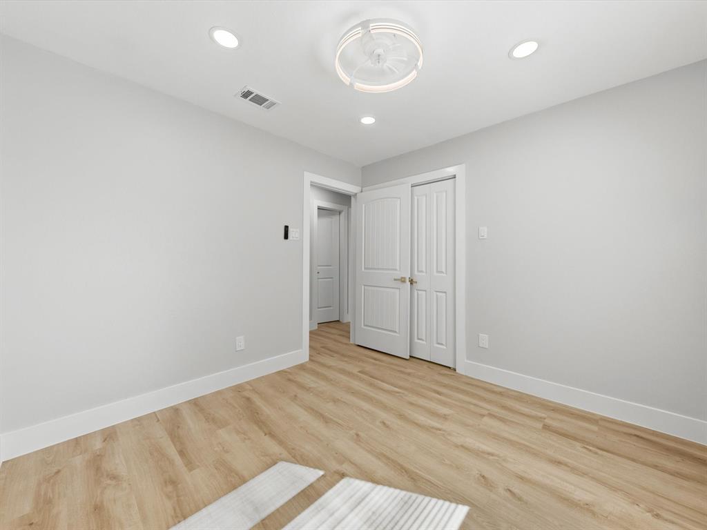 4013 Oleander Trail Mesquite, TX 75150 - Photo 18 of 28 Unfurnished bedroom with light wood-type flooring, a closet, and recessed lighting