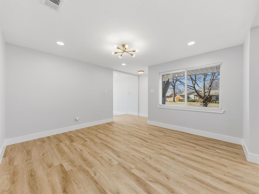 4013 Oleander Trail Mesquite, TX 75150 - Photo 6 of 28 Unfurnished room featuring a chandelier, light wood-type flooring, and recessed lighting