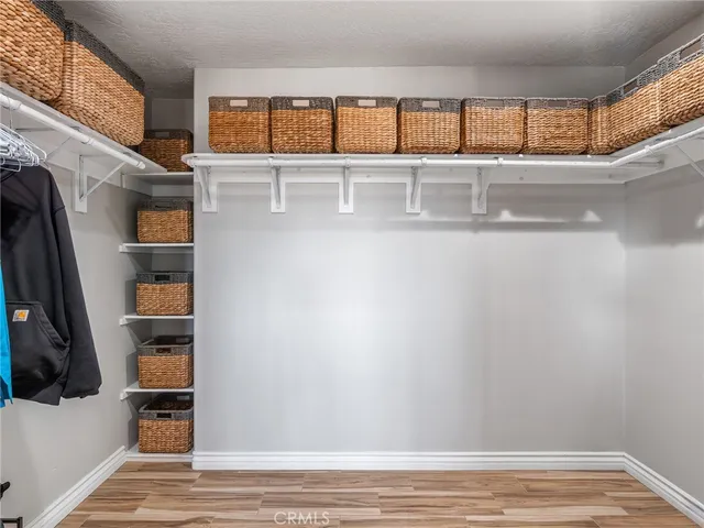 a view of room with a window and wooden floor