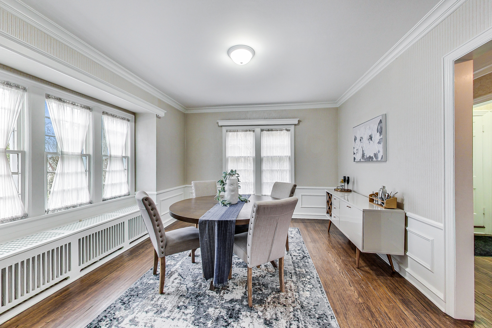 405 North Ashland Avenue Park Ridge, IL 60068 - Photo 12 of 30 a dining room with furniture a rug and wooden floor