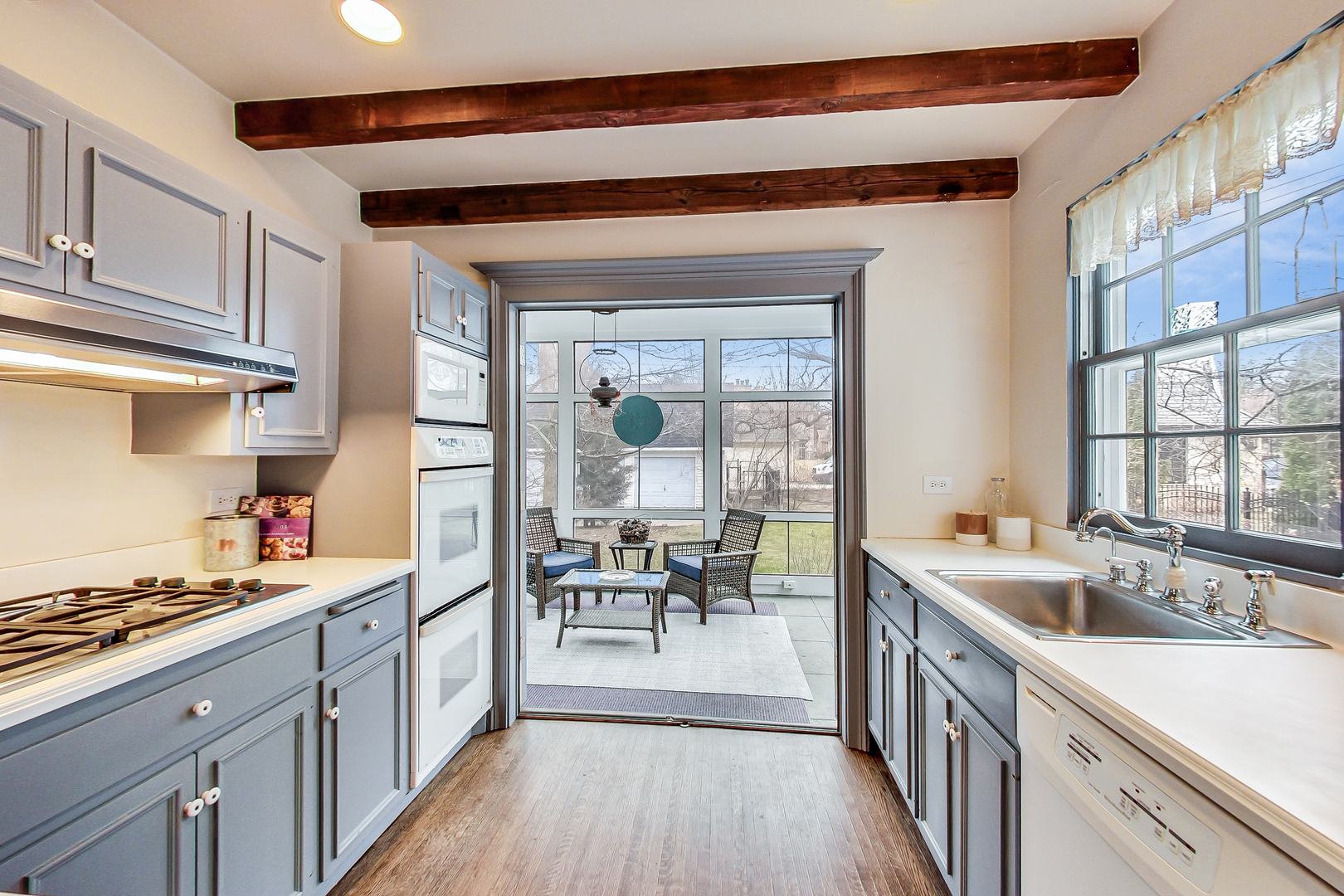 405 North Ashland Avenue Park Ridge, IL 60068 - Photo 14 of 30 a kitchen with sink cabinets and wooden floor