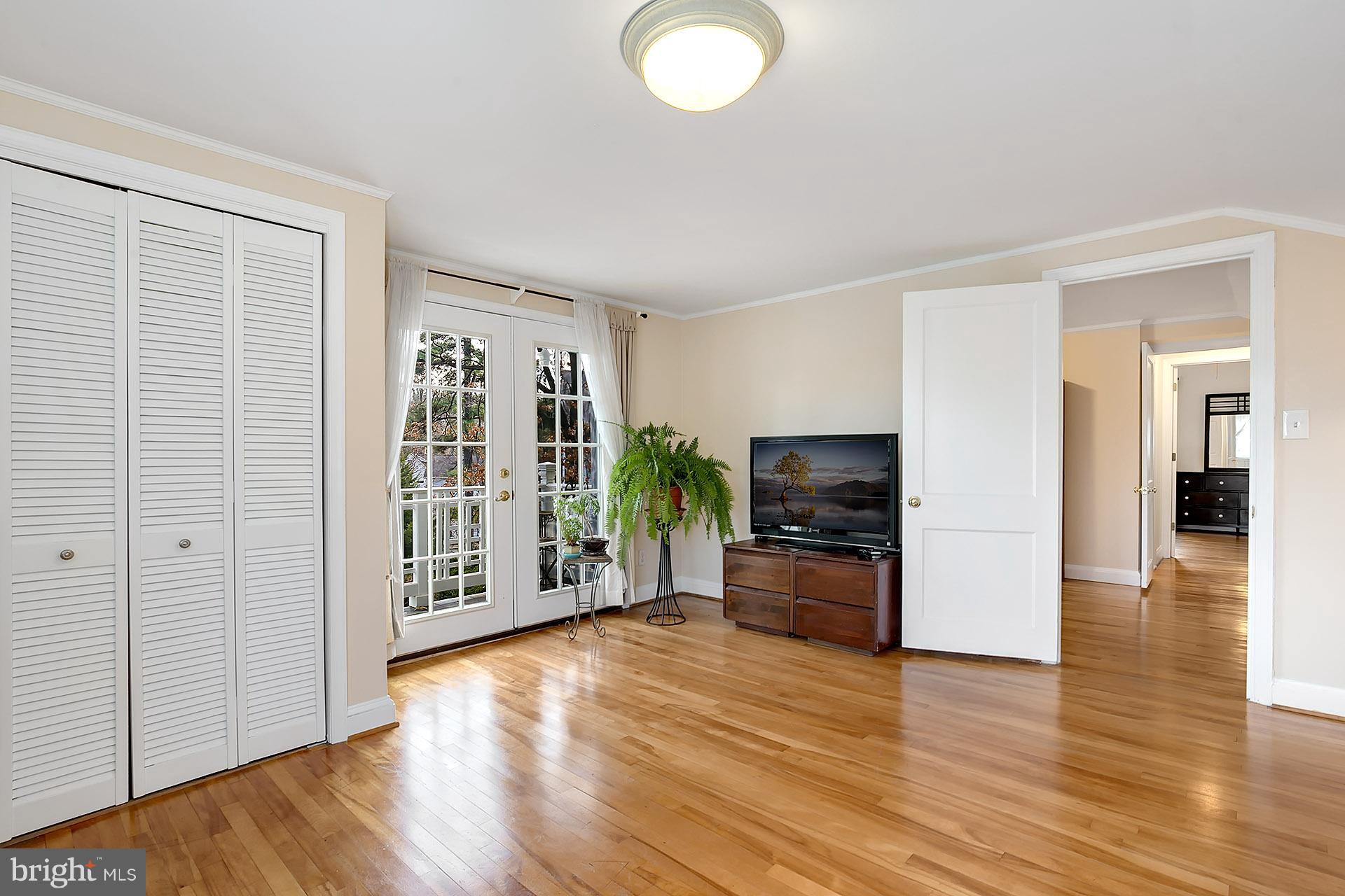210 West Braddock Road Alexandria, VA 22302 - Photo 22 of 30 an empty room with wooden floor and windows