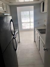 3645 West Northgate Drive, Unit 202 Irving, TX 75062 - Photo 8 of 12 a view of a livingroom with wooden floor and a window
