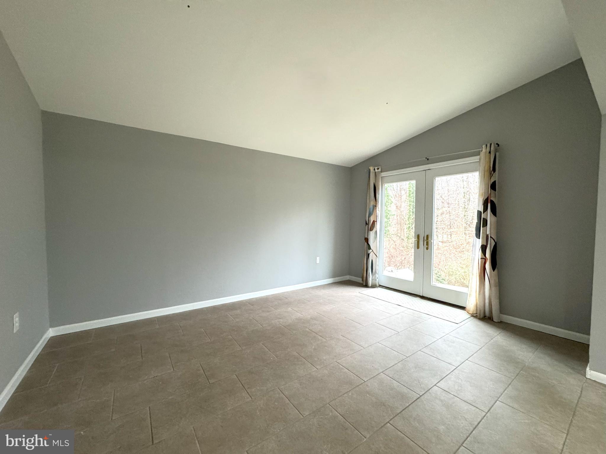 4350 Dalrymple Road Chesapeake Beach, MD 20732 - Photo 13 of 15 an empty room with windows