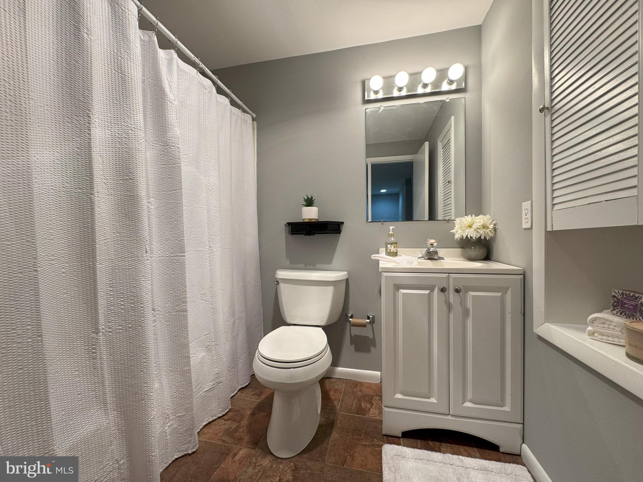 4350 Dalrymple Road Chesapeake Beach, MD 20732 - Photo 7 of 15 a bathroom with a sink toilet and vanity