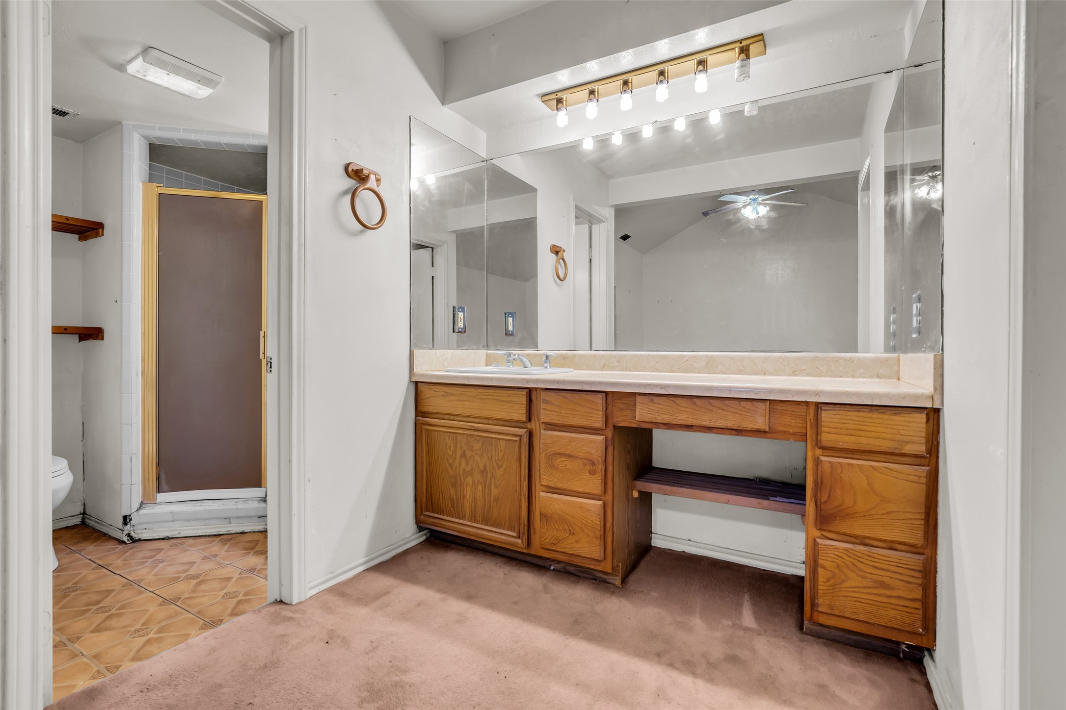 22980 Jade Street Porter, TX 77365 - Photo 11 of 32 a bathroom with a sink vanity and mirror