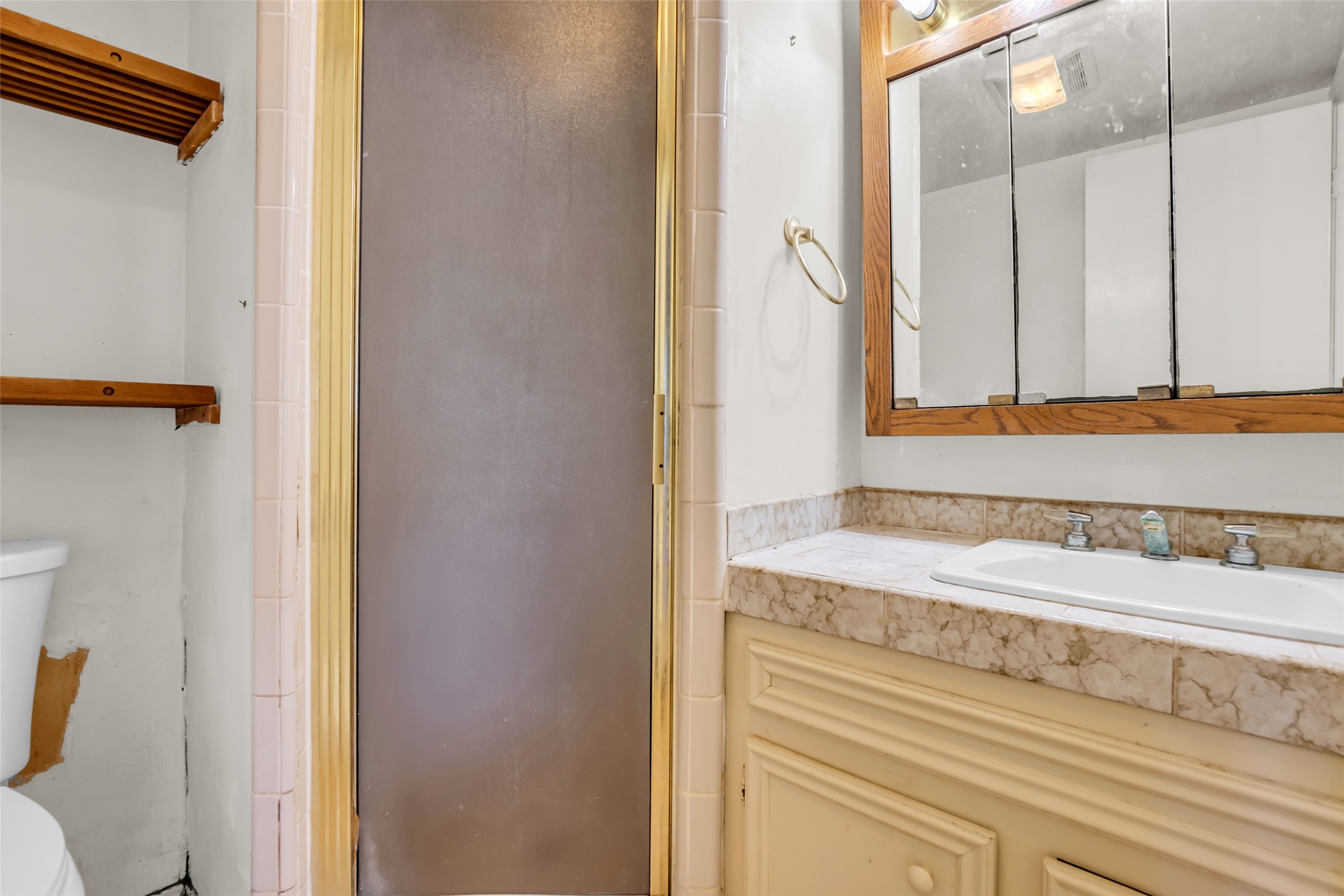 22980 Jade Street Porter, TX 77365 - Photo 12 of 32 a bathroom with a sink and a mirror