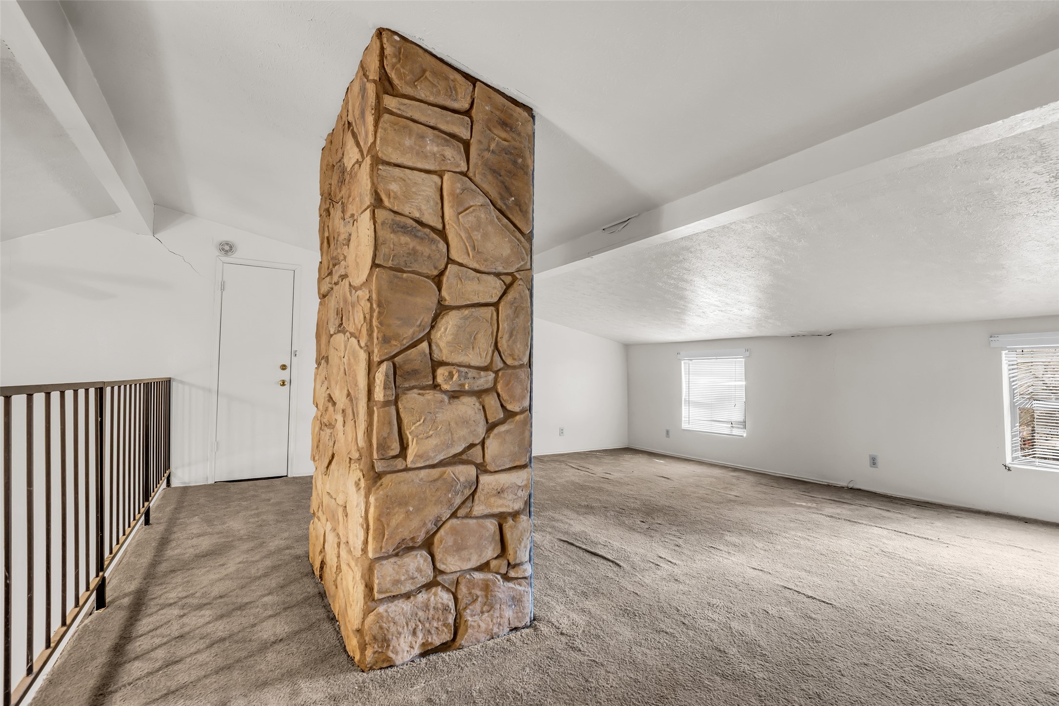 22980 Jade Street Porter, TX 77365 - Photo 18 of 32 an empty room with windows and white walls