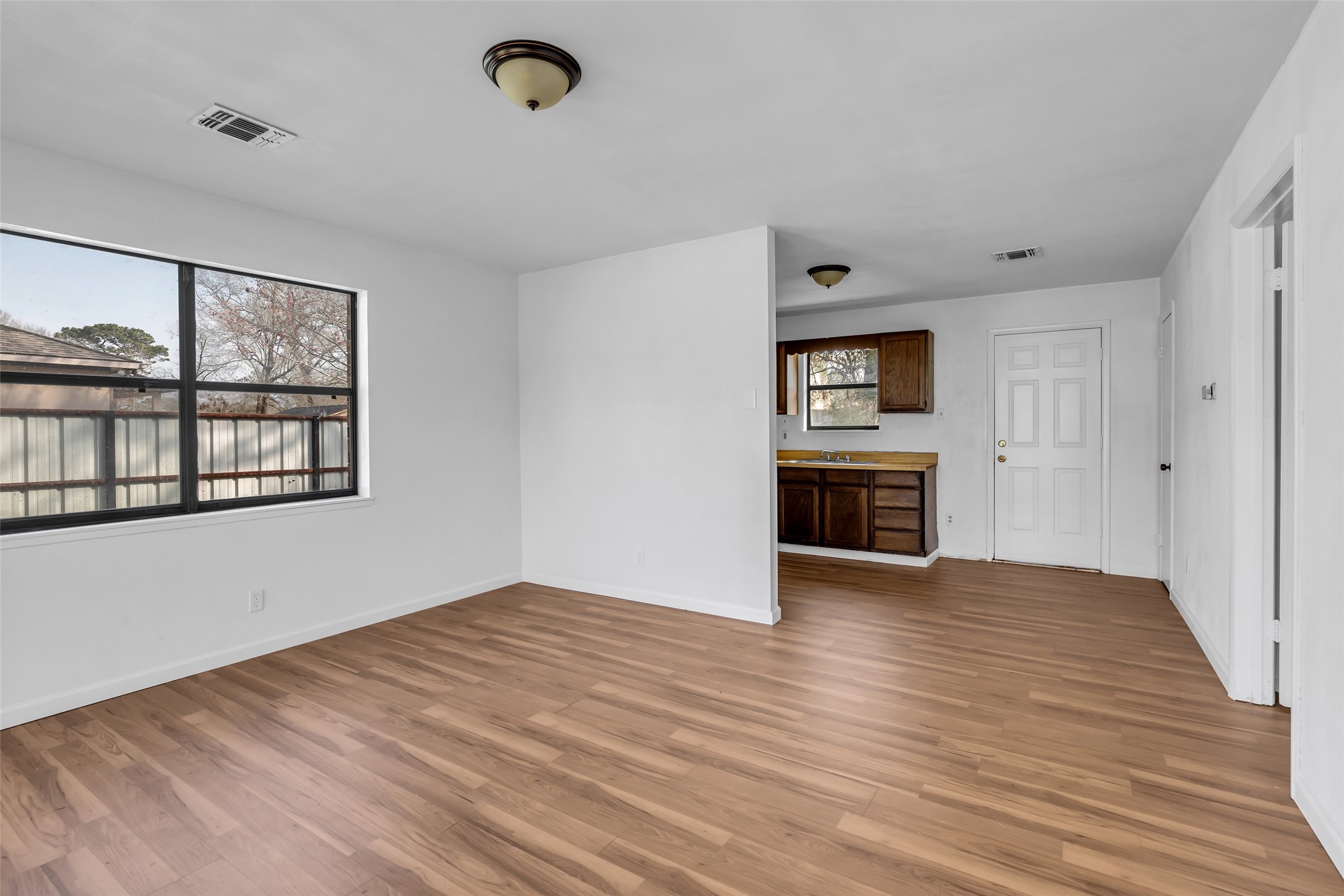 22980 Jade Street Porter, TX 77365 - Photo 20 of 32 a view of empty room with wooden floor and fan