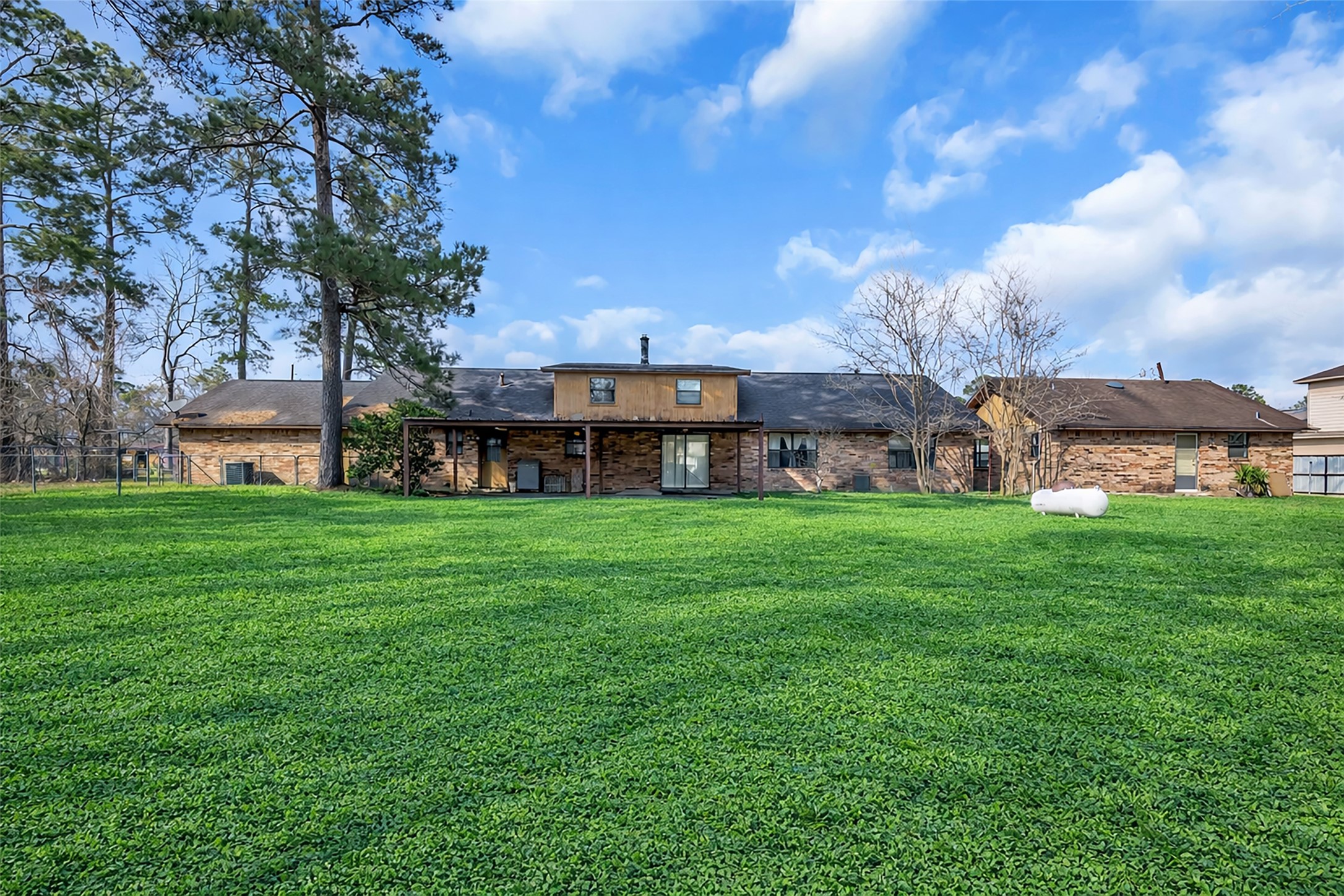 22980 Jade Street Porter, TX 77365 - Photo 26 of 32 a view of a house with a big yard