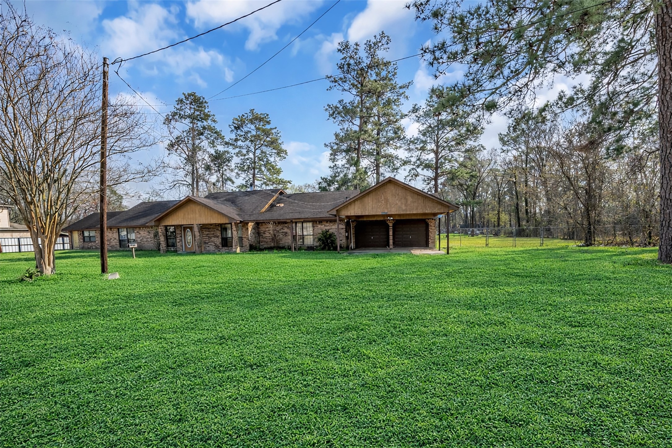 22980 Jade Street Porter, TX 77365 - Photo 27 of 32 a front view of a house with garden