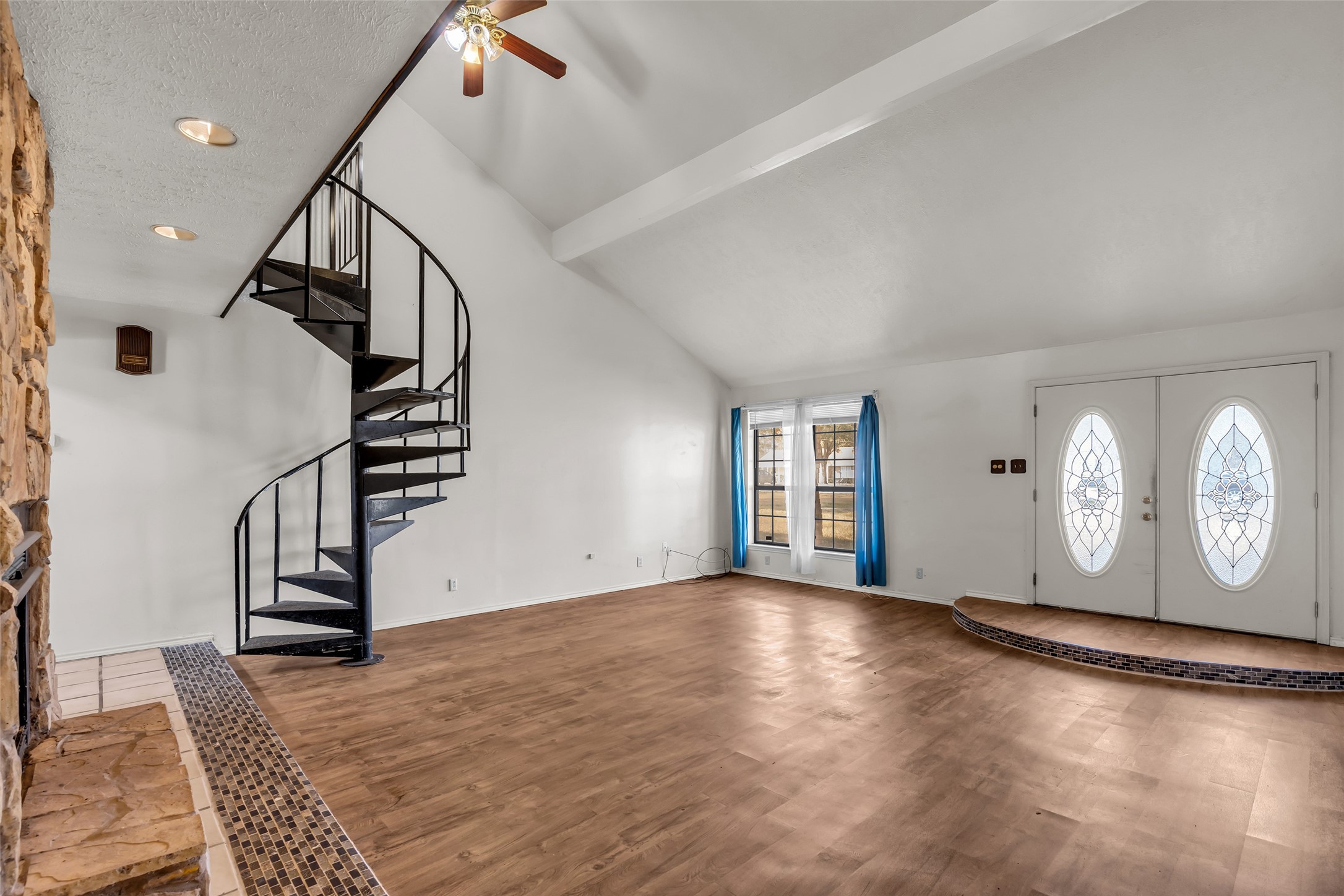 22980 Jade Street Porter, TX 77365 - Photo 3 of 32 a view of an empty room with wooden floor and stairs