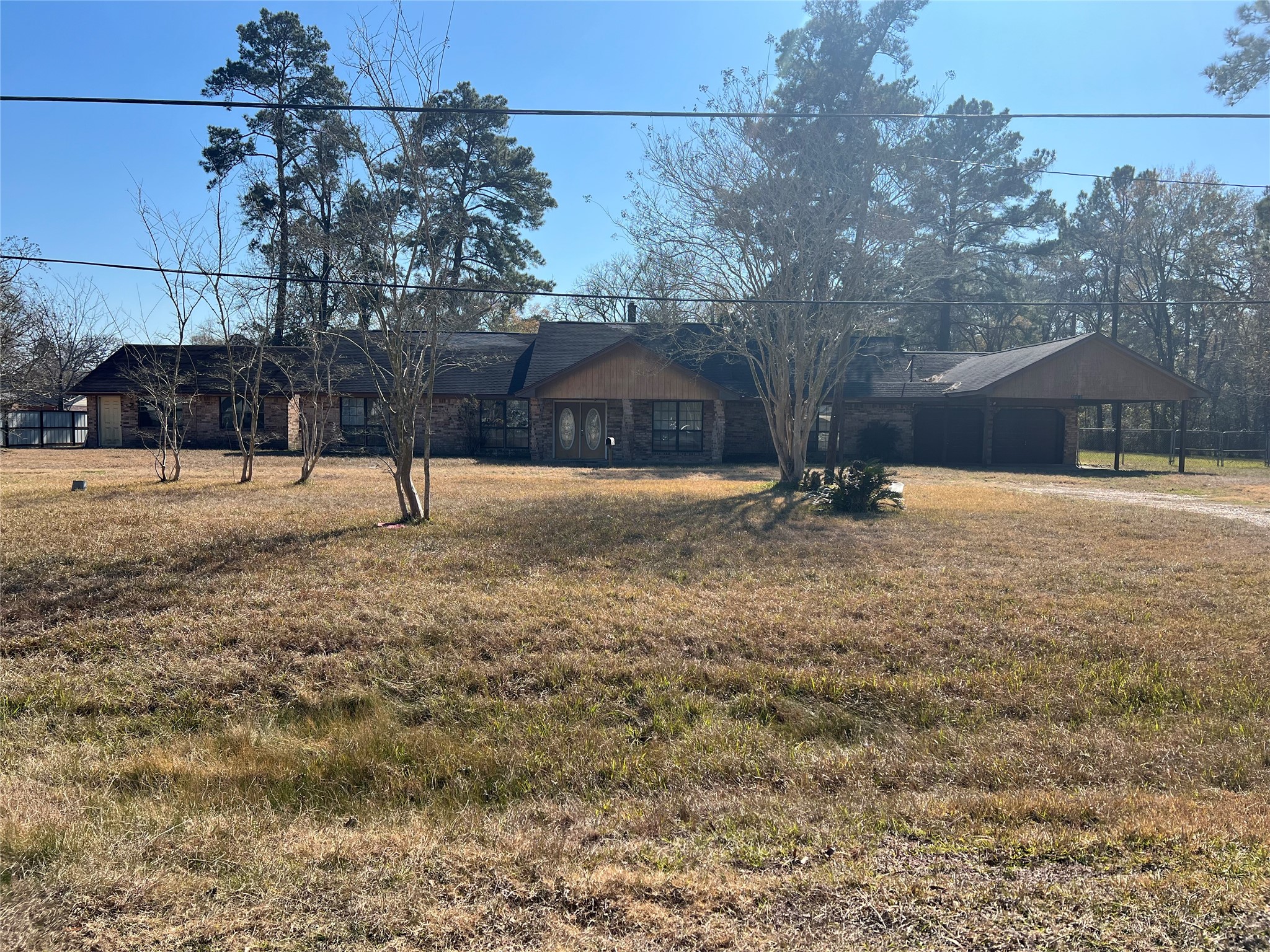 22980 Jade Street Porter, TX 77365 - Photo 32 of 32 a backyard of apartments with large trees