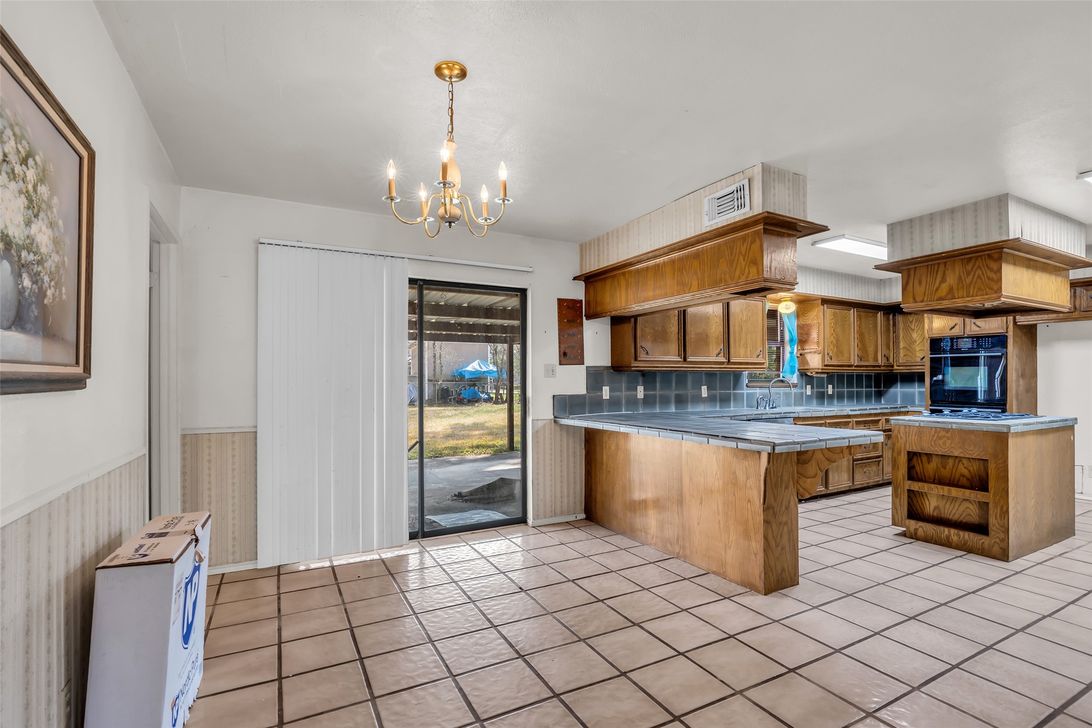 22980 Jade Street Porter, TX 77365 - Photo 5 of 32 a kitchen with stainless steel appliances granite countertop a sink and a refrigerator