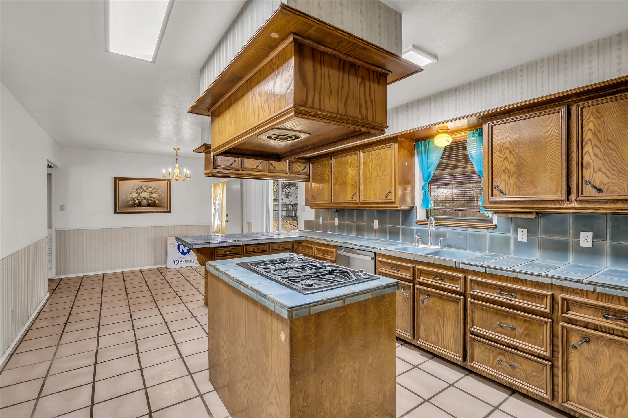 22980 Jade Street Porter, TX 77365 - Photo 8 of 32 a kitchen with stainless steel appliances granite countertop a stove a sink dishwasher and cabinets with wooden floor
