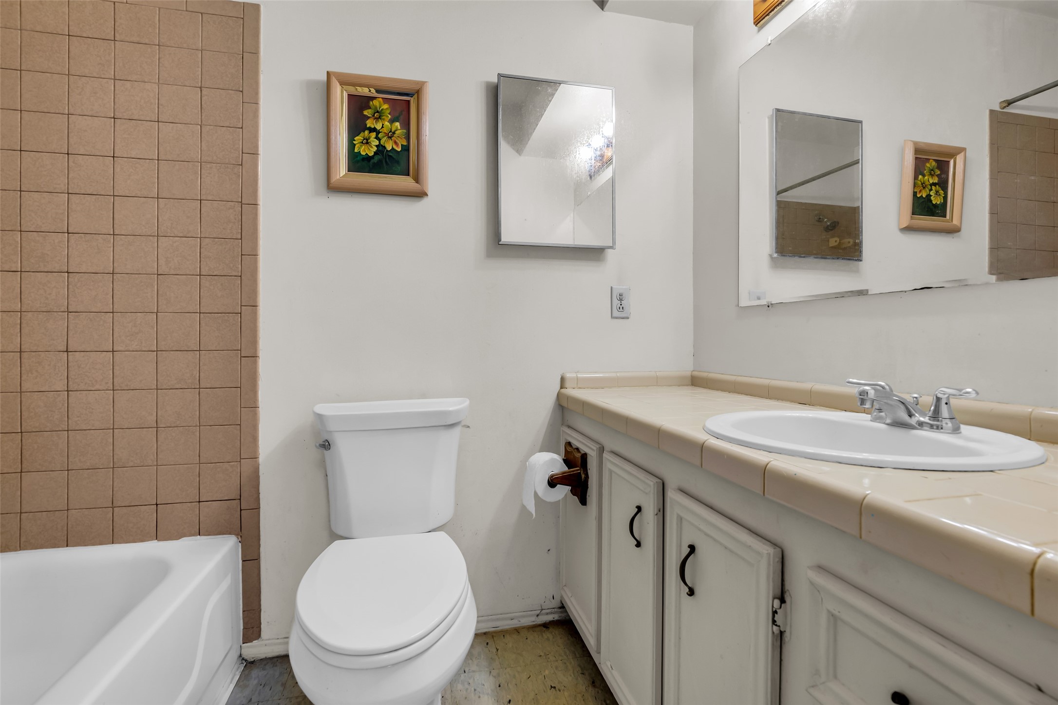 22980 Jade Street Porter, TX 77365 - Photo 9 of 32 a bathroom with a granite countertop toilet sink and mirror