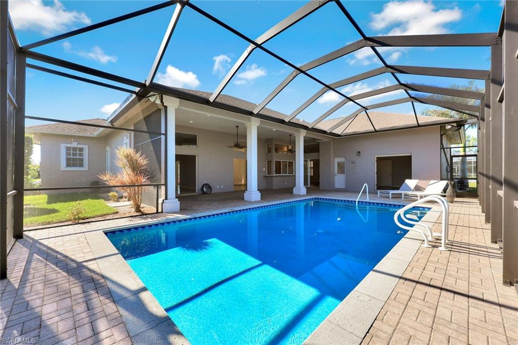 2035 Castle Garden Lane Naples, FL 34110 - Photo 29 of 40 a view of swimming pool with seating area
