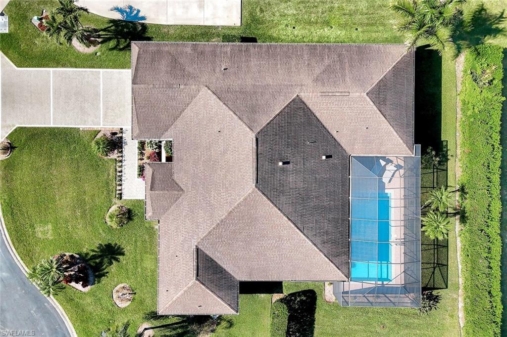 2035 Castle Garden Lane Naples, FL 34110 - Photo 39 of 40 an aerial view of a house with garden space and car parked