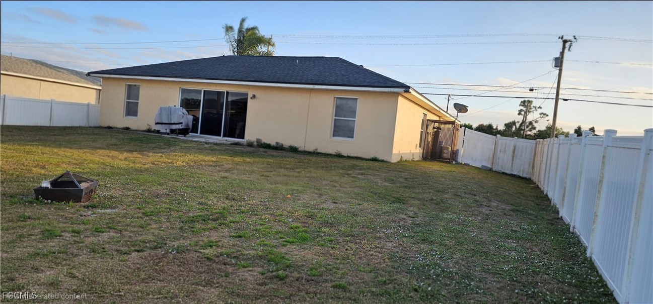 3910 23rd Street Southwest Lehigh Acres, FL 33976 - Photo 13 of 16 a big house with swimming pool in front of it