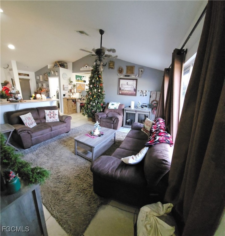 3910 23rd Street Southwest Lehigh Acres, FL 33976 - Photo 4 of 16 a living room with furniture and a window