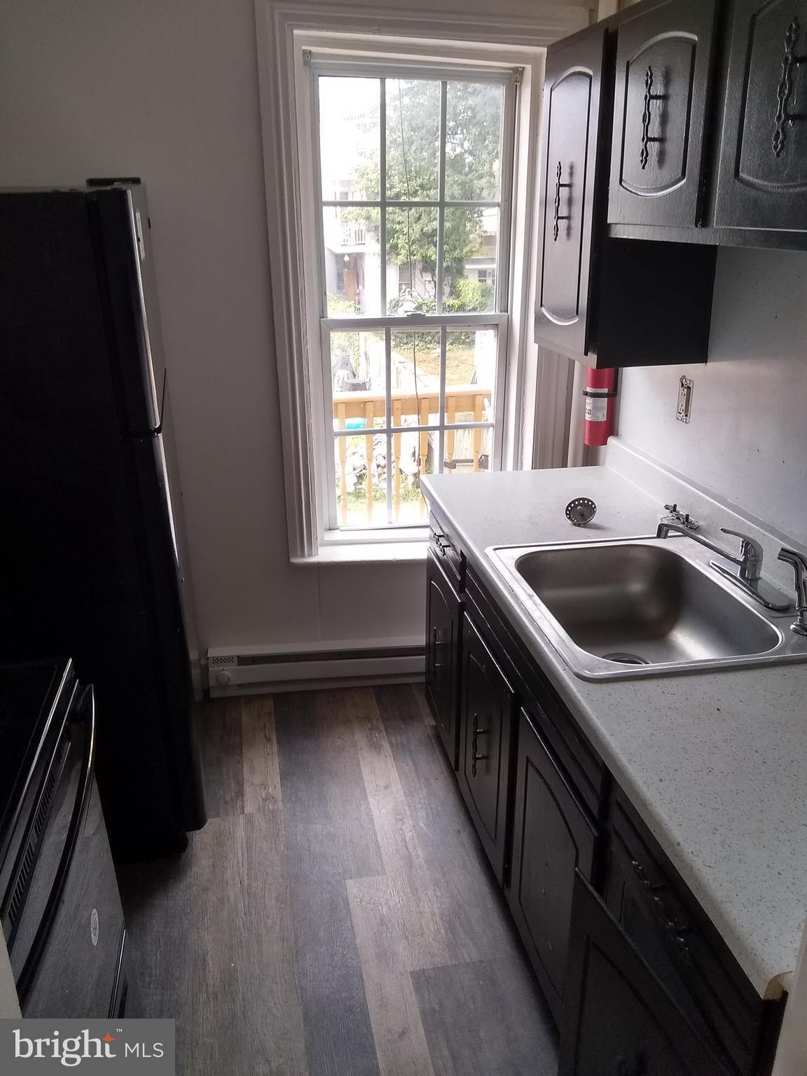 a kitchen that has a sink and a stove