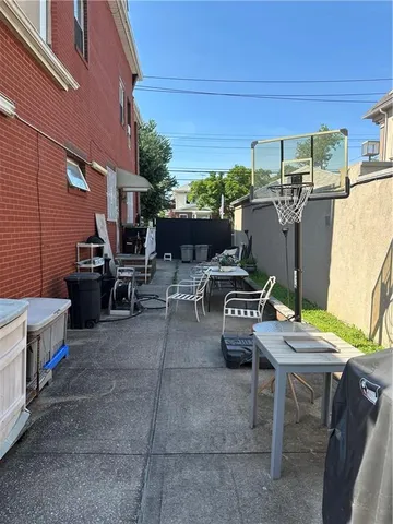 a view of a patio with table and chairs
