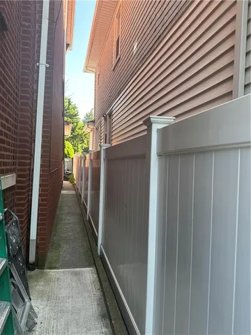 a view of a pathway besides a house