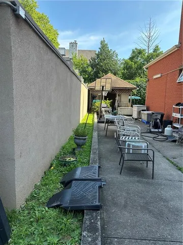 a view of a backyard with sitting area