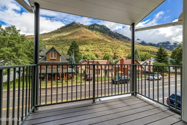 a view of a balcony with wooden floor