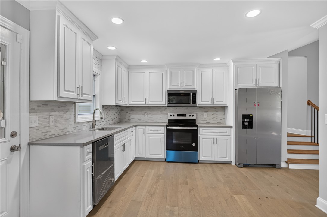 712 Beech Drive Seneca, SC 29678 - Photo 14 of 41 A contemporary culinary space with light wood flooring and stainless steel appliances awaits your gourmet creations.
