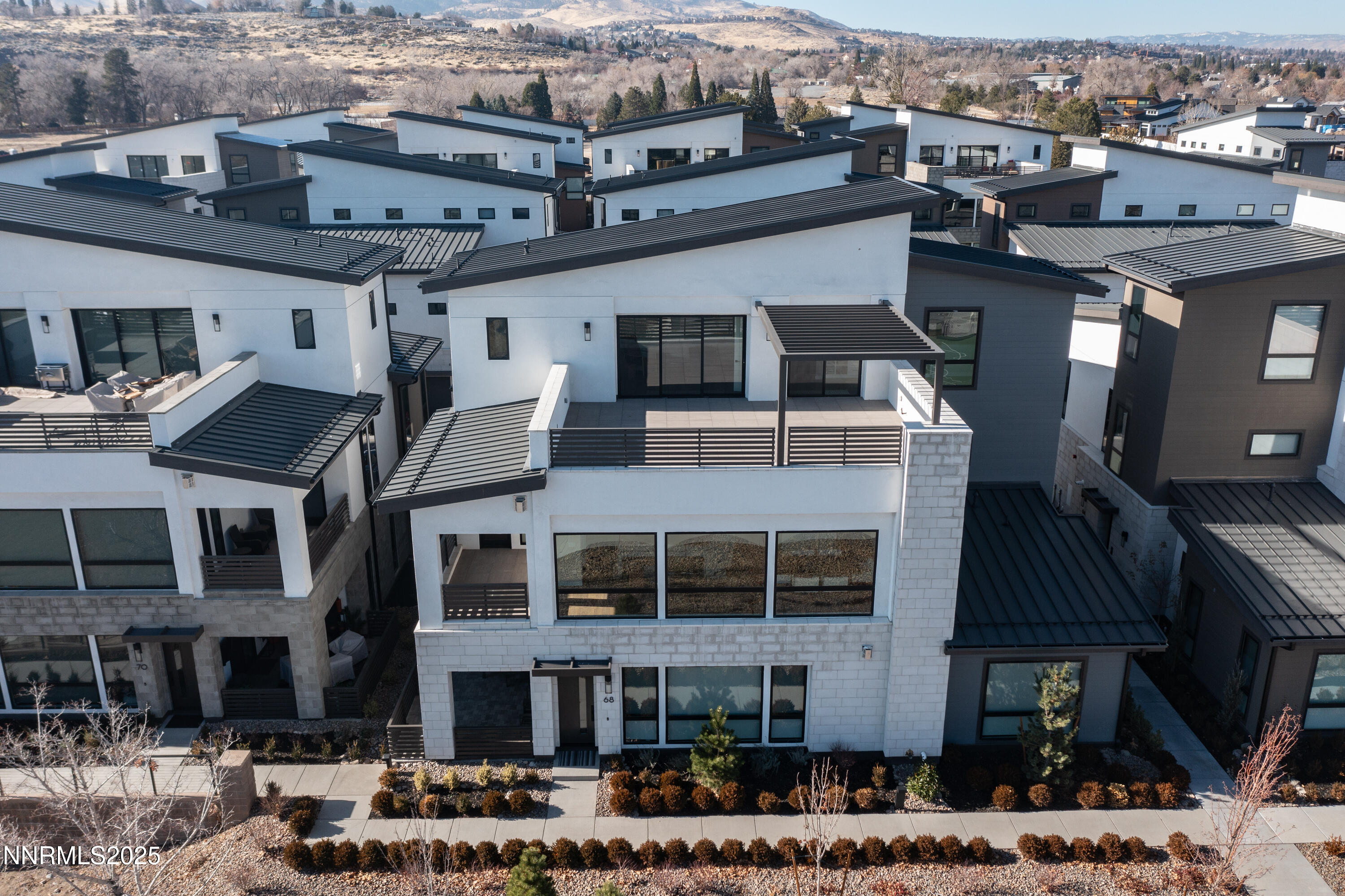 a front view of a building with a lot of windows