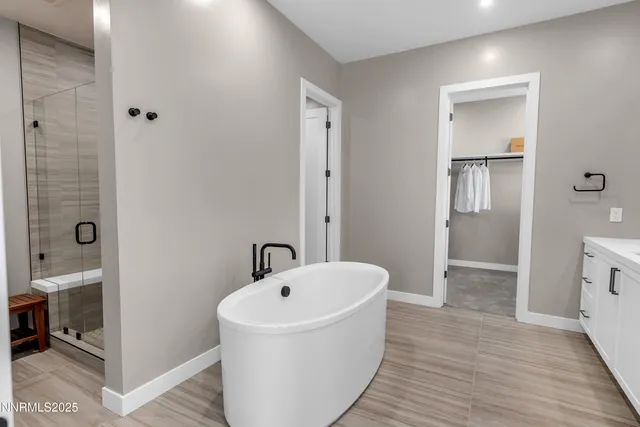 a bathroom with a bathtub and a sink