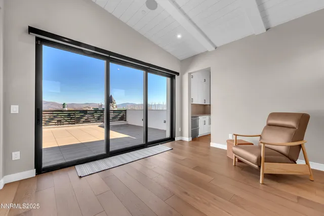 a view of an empty room with glass door
