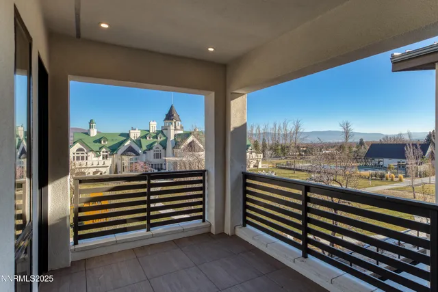 a view of a balcony and dining area