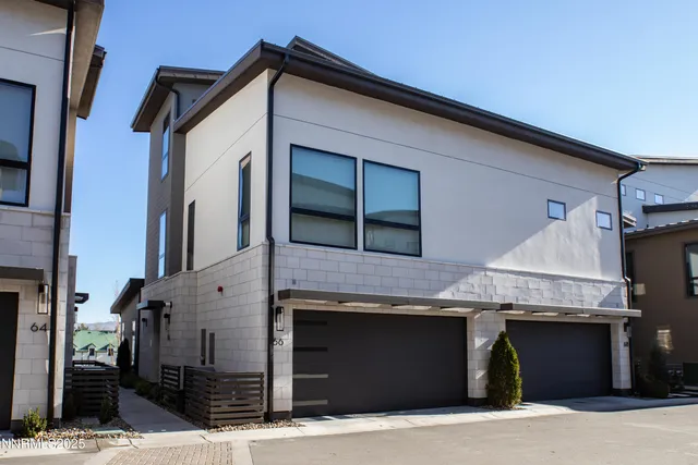 a front view of a house with garage