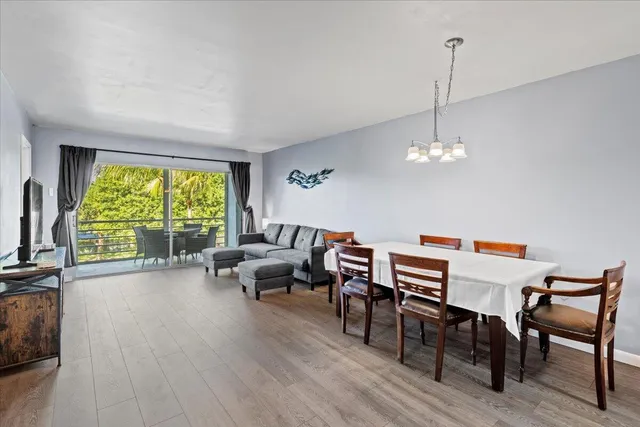 a kitchen with a refrigerator sink and cabinets