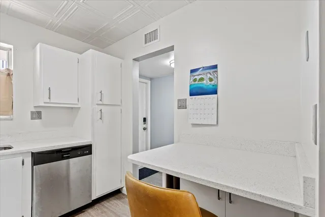 a dining room with a table and chairs