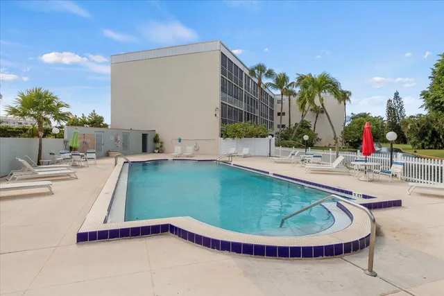 a view of a swimming pool with a patio