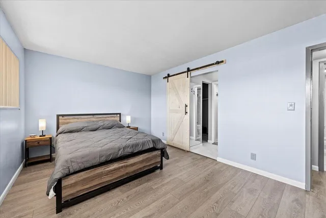 a bedroom with a bed and a dresser