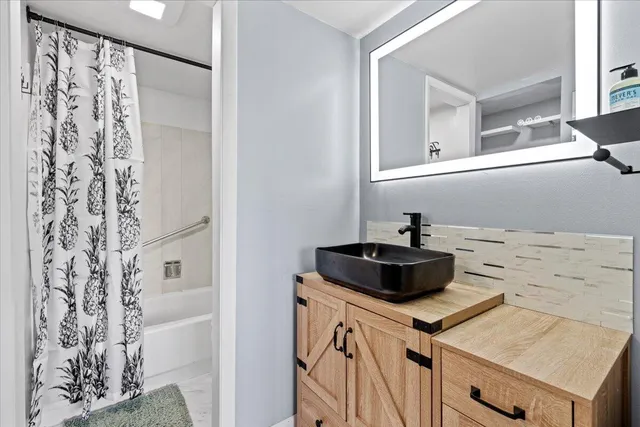 a bathroom with a toilet and shower